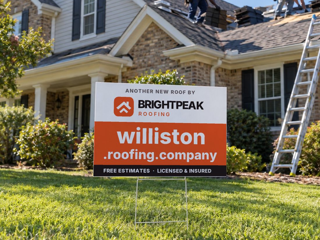 williston.roofing.company on a yard sign in front of a house getting a new roof